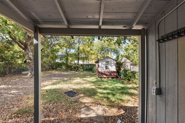 820 Allen St, Denton, TX 76205 - view of yard with a storage shed, fence, and an outbuilding