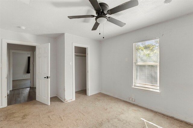 820 Allen St, Denton, TX 76205 - unfurnished bedroom featuring carpet floors, baseboards, a ceiling fan, and a closet