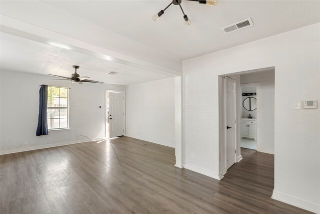 820 Allen St, Denton, TX 76205 - unfurnished living room featuring ceiling fan, baseboards, visible vents, and dark wood finished floors