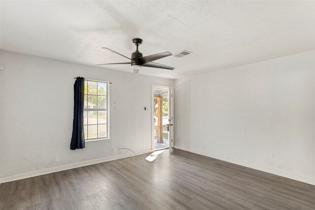 820 Allen St, Denton, TX 76205 - spare room with baseboards, ceiling fan, wood finished floors, and visible vents