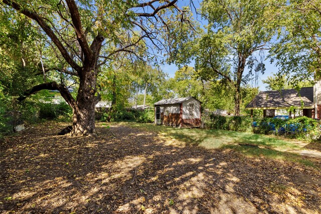 820 Allen St, Denton, TX 76205 - view of yard featuring a storage shed and an outdoor structure