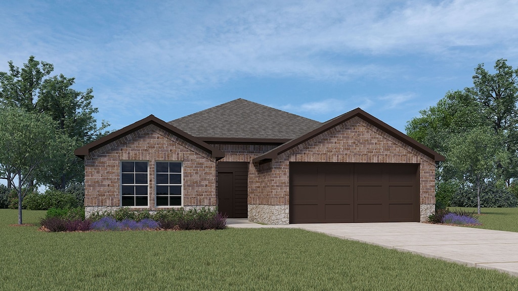 view of front of house featuring a garage and a front lawn