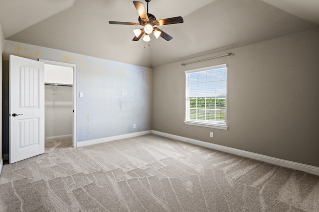 unfurnished bedroom featuring light colored carpet, ceiling fan, and a closet