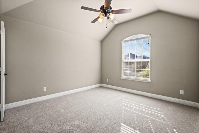 interior space with carpet, lofted ceiling, and ceiling fan