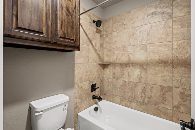 bathroom featuring toilet and tiled shower / bath combo