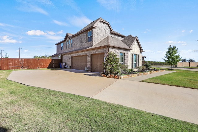 view of home's exterior featuring a garage and a lawn