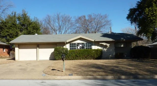 single story home with a garage