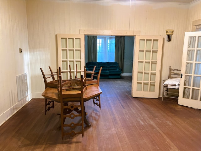 dining space featuring wood finished floors and visible vents