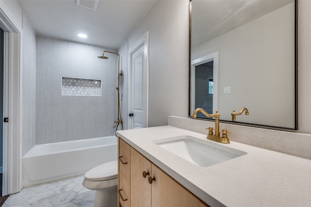 full bathroom with toilet, vanity, and tiled shower / bath