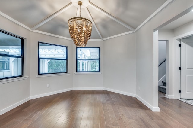 10544 Cox Ln, Dallas, TX 75229 - unfurnished room with a chandelier, lofted ceiling, stairs, and wood finished floors