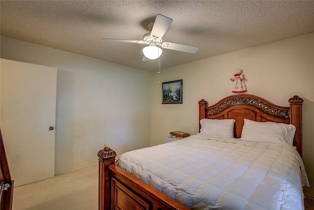 bedroom with light carpet, a textured ceiling, and ceiling fan