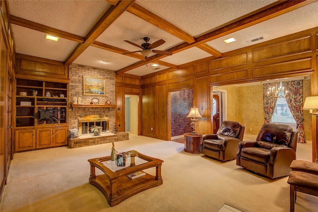 carpeted living room with beam ceiling, coffered ceiling, a textured ceiling, and a brick fireplace