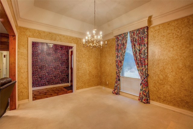 unfurnished room with carpet, crown molding, a chandelier, and a raised ceiling