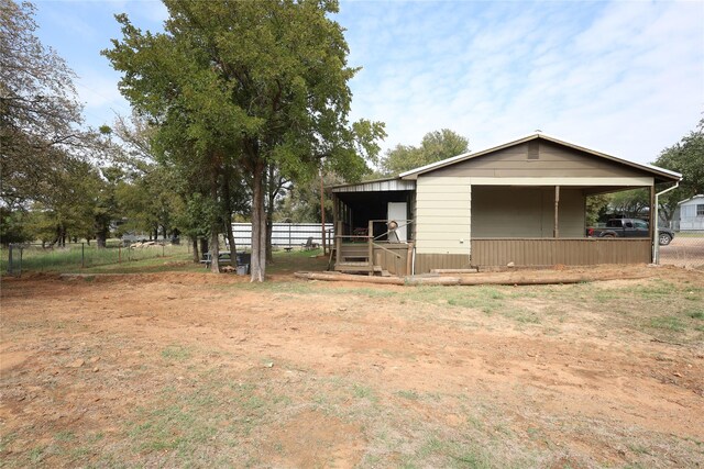 4240 Cheyenne Dr, May, TX 76857 - exterior space featuring a pole building, fence, and an outbuilding