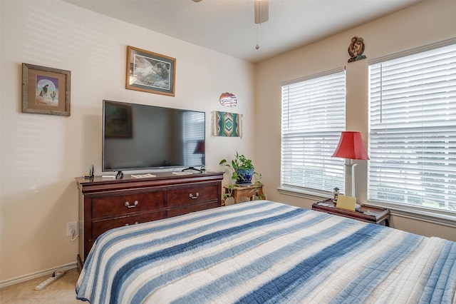 bedroom with light colored carpet and ceiling fan