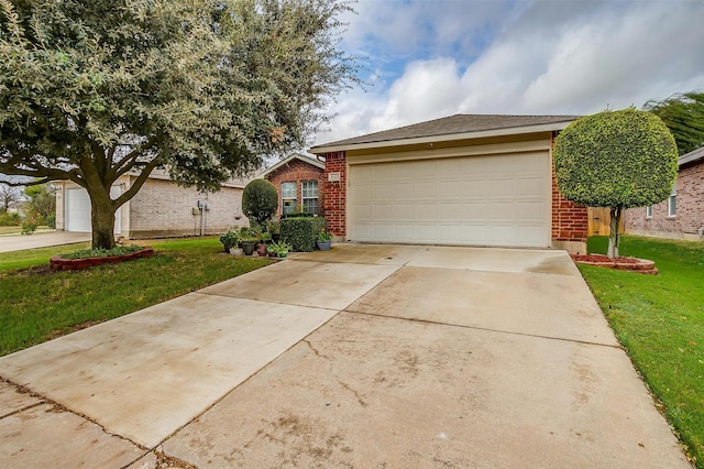 ranch-style house featuring a garage and a front lawn