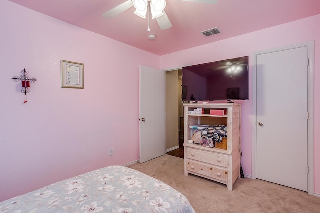 carpeted bedroom featuring ceiling fan