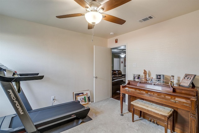 interior space featuring ceiling fan and light colored carpet