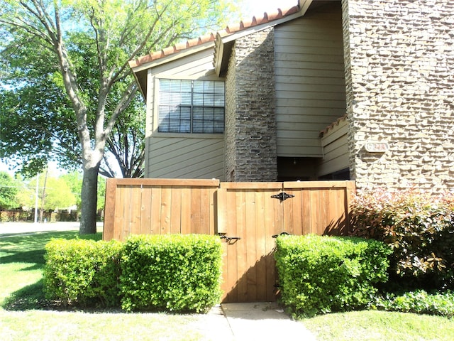 view of side of property with a yard