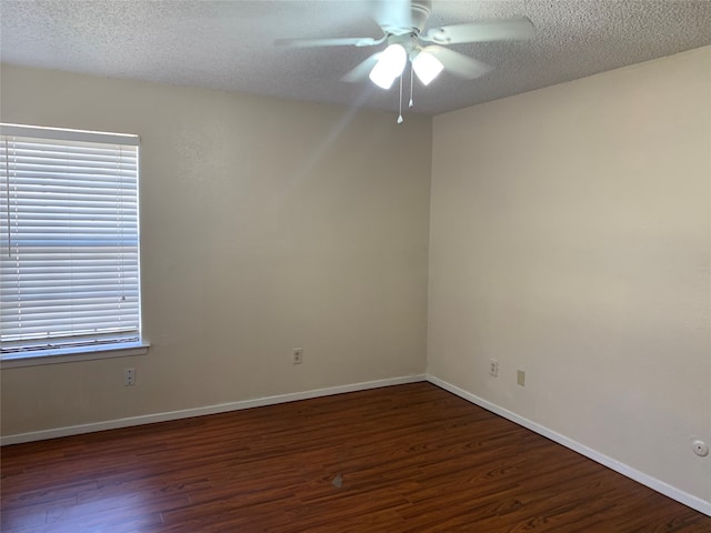 unfurnished room featuring ceiling fan, a textured ceiling, and dark hardwood / wood-style flooring