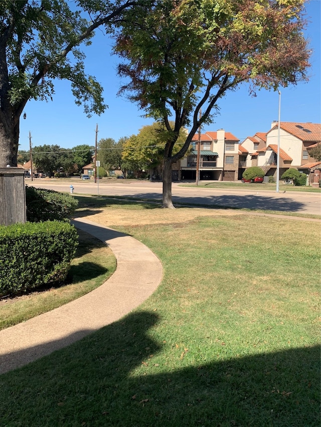 view of community featuring a yard