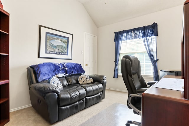 office area featuring light carpet and vaulted ceiling