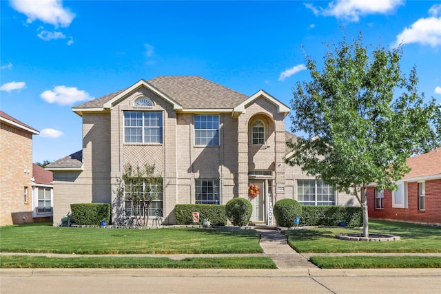 front facade with a front yard