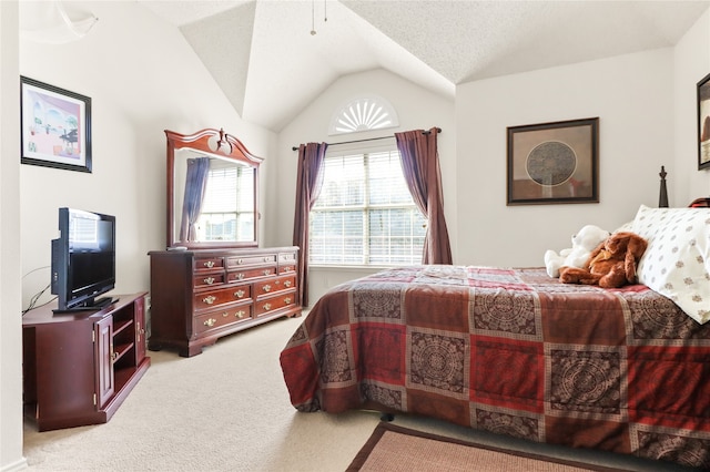 carpeted bedroom featuring lofted ceiling and a textured ceiling