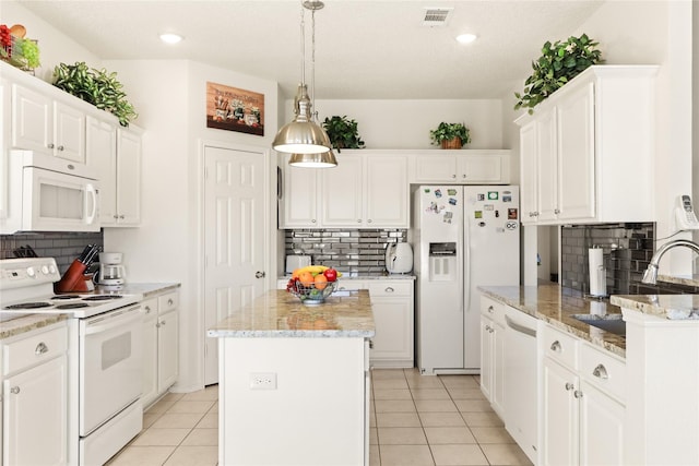 kitchen with a kitchen island, white cabinets, tasteful backsplash, and white appliances