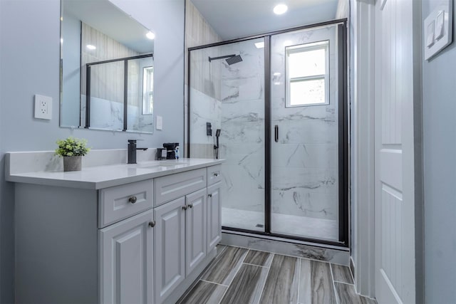 bathroom with vanity and walk in shower