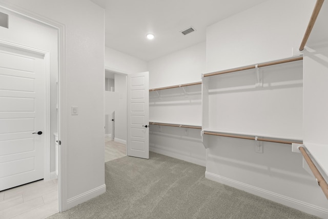 spacious closet with carpet and visible vents