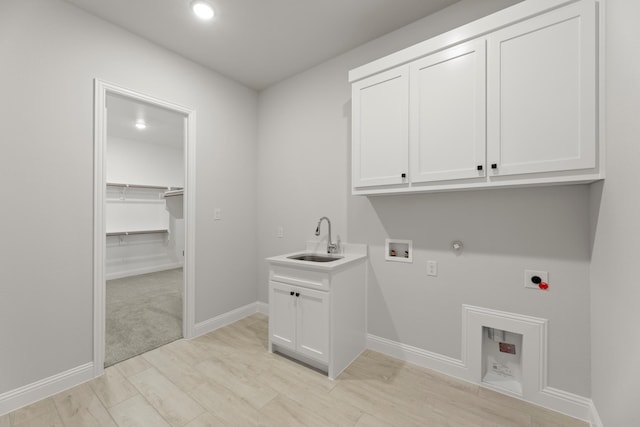 laundry room with hookup for a gas dryer, hookup for an electric dryer, washer hookup, a sink, and cabinet space