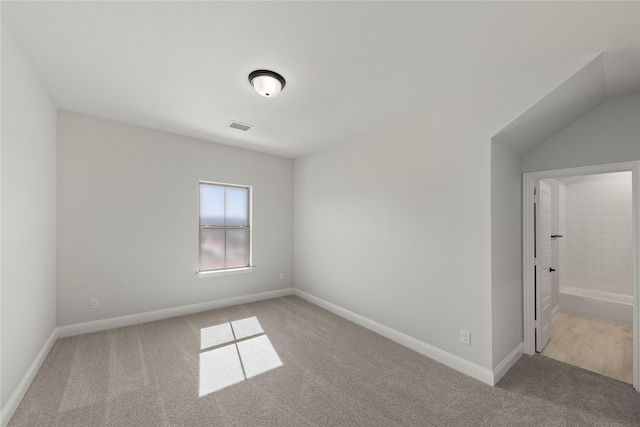 unfurnished room featuring baseboards, visible vents, and carpet flooring