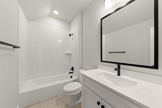 full bathroom featuring shower / bathtub combination, lofted ceiling, toilet, wood finished floors, and vanity