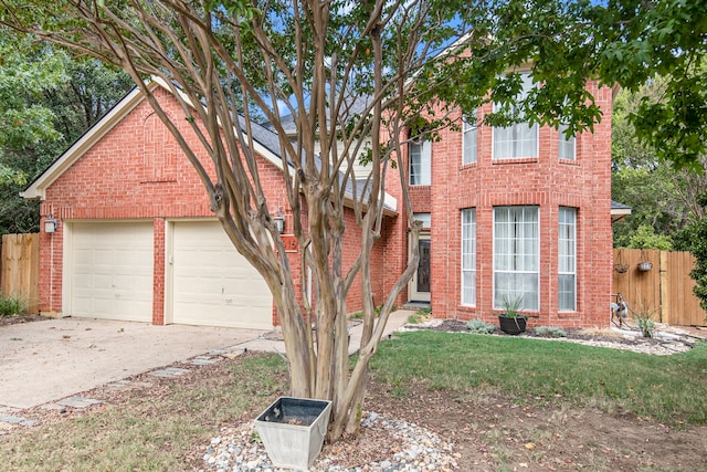 view of front of home with a garage and a front yard