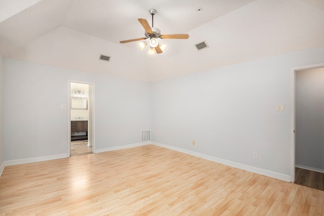 spare room featuring vaulted ceiling, ceiling fan, and light hardwood / wood-style flooring