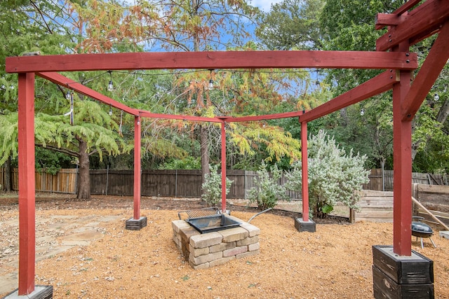 view of property's community with a fire pit