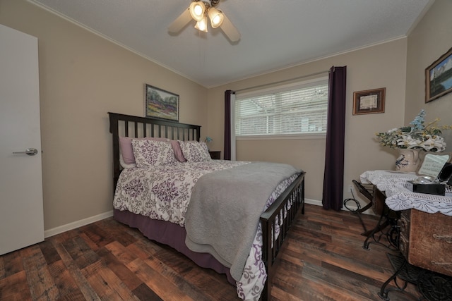 bedroom featuring ceiling fan, crown molding, and dark hardwood / wood-style floors