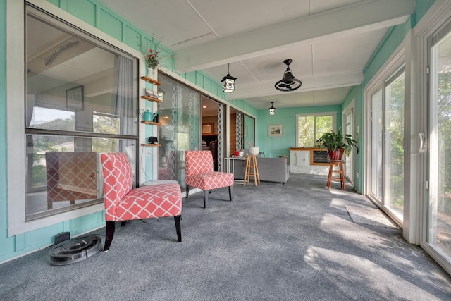 sunroom with beamed ceiling