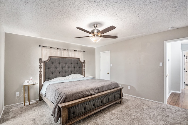 bedroom featuring a textured ceiling, carpet, and ceiling fan