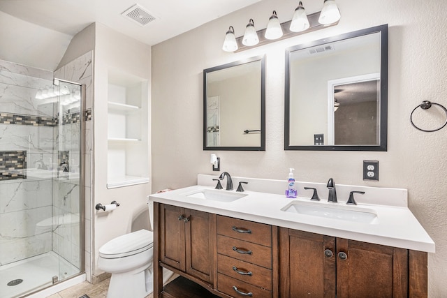 bathroom featuring vanity, toilet, vaulted ceiling, and a shower with shower door