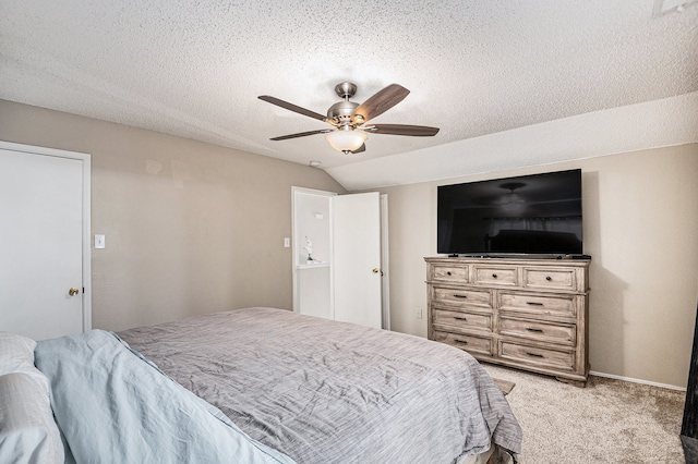 carpeted bedroom with a textured ceiling, vaulted ceiling, and ceiling fan