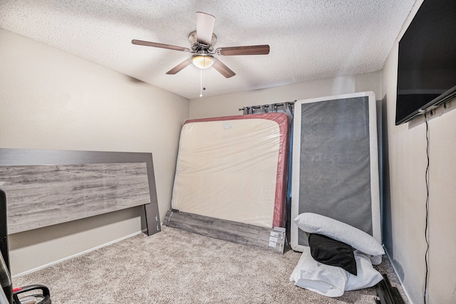 bedroom with light carpet, a textured ceiling, and ceiling fan