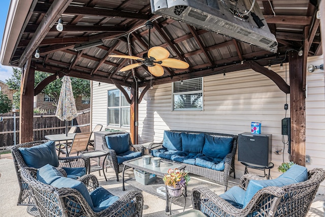 view of patio featuring a gazebo, an outdoor hangout area, and ceiling fan