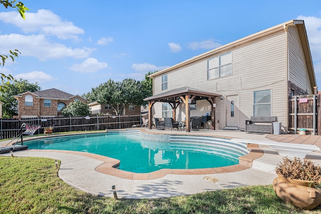 view of swimming pool featuring a patio, a gazebo, and a diving board