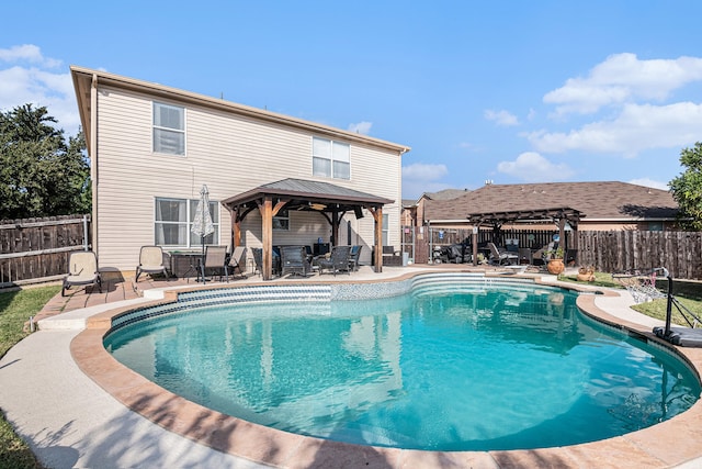 view of swimming pool featuring a gazebo and a patio area