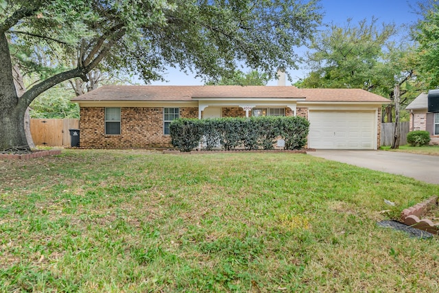 ranch-style house with a front yard and a garage