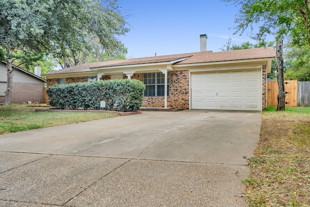 single story home featuring a garage