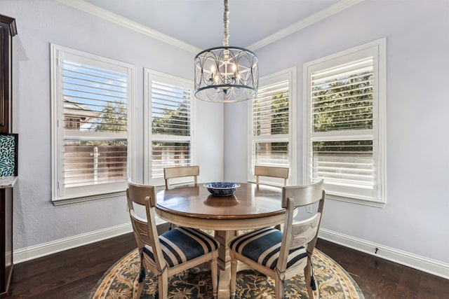 dining room with dark wood-type flooring, a notable chandelier, and crown molding