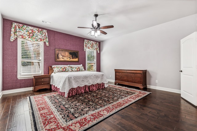 bedroom with ceiling fan and dark hardwood / wood-style floors